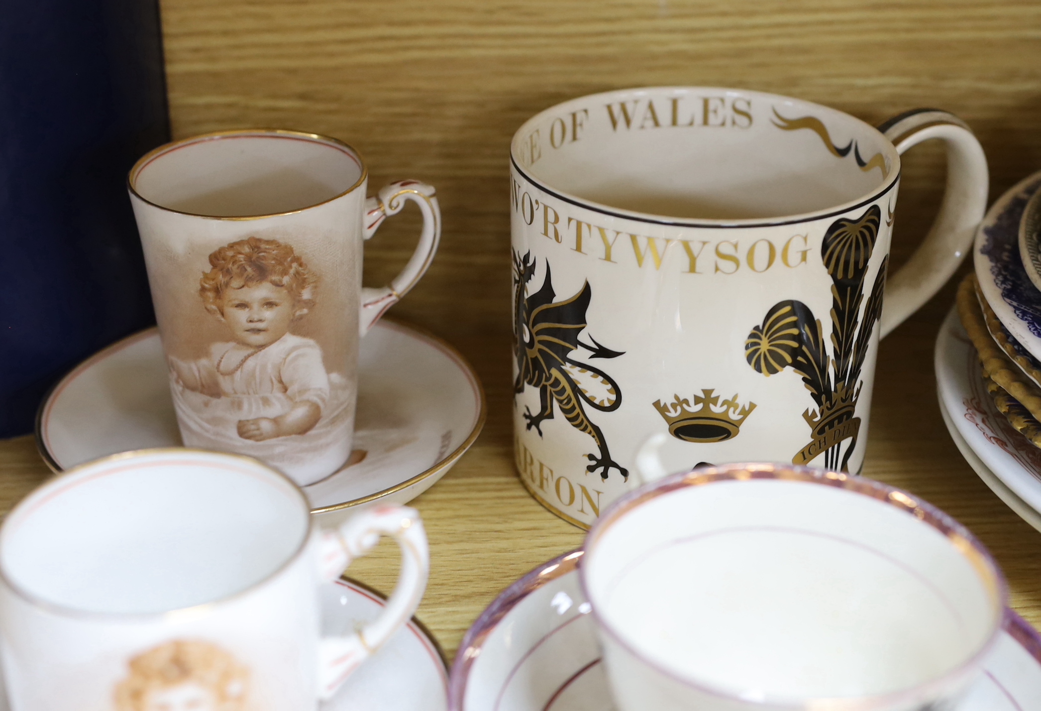 A mixed varied collection of 19th century and later commemorative wares to include a Princess Charlotte lustre cup and saucer, Victoria and Albert nursing plates, cups etc, the largest 25cm in diameter